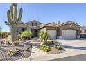 Beautiful desert landscape with a two-car garage home at 5500 N Globe Dr, Eloy, AZ 85131