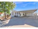 Home exterior with covered parking and landscaping at 8500 E Southern Ave # 506, Mesa, AZ 85209