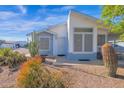 House exterior with desert landscaping and carport at 8500 E Southern Ave # 506, Mesa, AZ 85209