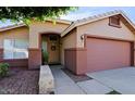 House exterior showcasing a two-tone paint scheme and a neatly kept walkway at 8605 W Paradise Dr, Peoria, AZ 85345