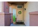 Inviting front door entrance with a wreath and a welcome mat at 8605 W Paradise Dr, Peoria, AZ 85345