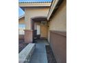 Front entryway with stone walkway leading to a tan door at 8605 W Paradise Dr, Peoria, AZ 85345