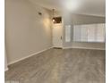 Bright living room with tile floors and neutral walls at 8605 W Paradise Dr, Peoria, AZ 85345