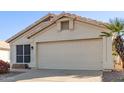 Single story home with a two car garage and desert landscaping at 901 N Longmore St, Chandler, AZ 85224