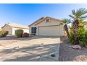 Single-story house with a two-car garage and landscaping at 901 N Longmore St, Chandler, AZ 85224