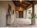 Covered patio with rustic wood beams and tile flooring at 9820 E Thompson Peak Pkwy # 646, Scottsdale, AZ 85255