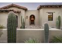 Spanish-style home with cacti and brick entryway at 9820 E Thompson Peak Pkwy # 646, Scottsdale, AZ 85255