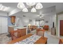 Charming dining area with a table and chairs, offering a view of the living room at 10136 E Southern Ave # 1045, Mesa, AZ 85209