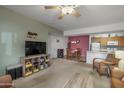 Open living space showcasing a large TV and adjacent dining area at 10136 E Southern Ave # 1045, Mesa, AZ 85209