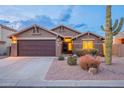 One-story home with a two-car garage and desert landscaping at 10512 E Dutchmans Trl, Gold Canyon, AZ 85118