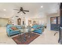 The living room features bright natural light, tile floors, with views of the dining area at 11802 S Half Moon Dr, Phoenix, AZ 85044