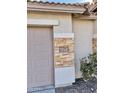 House number plaque on a stone facade at 12367 W Woodland Ave, Avondale, AZ 85323