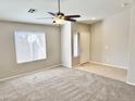 Living room featuring a window and entryway at 12367 W Woodland Ave, Avondale, AZ 85323