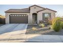 One-story house with brown garage door and neutral exterior at 12474 E Soloman Rd, Gold Canyon, AZ 85118