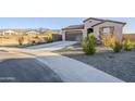 Modern single story home with mountain views and gravel driveway at 12474 E Soloman Rd, Gold Canyon, AZ 85118