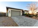 Modern home with a two-car garage and well-maintained landscaping at 12808 N 144Th Dr, Surprise, AZ 85379