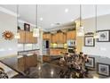 Spacious kitchen with granite countertops and wood cabinets at 12975 W Andrew Ln, Peoria, AZ 85383