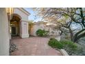 Elegant entryway with arched doorway and terracotta tile patio at 14845 S 31St Way, Phoenix, AZ 85048