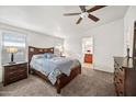 Relaxing bedroom with ceiling fan, comfortable bed, and ample closet space at 150 S Windsor -- # F87, Mesa, AZ 85204