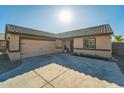 Single story home with a two-car garage and small front yard at 1537 E Caballero Dr, Casa Grande, AZ 85122