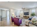 Spacious living room with tiled floors and a view to the backyard at 1572 E Artemis Trl, Queen Creek, AZ 85140