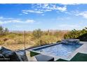 Enjoy mountain views from this backyard pool and patio area at 18022 E Vista Desierto --, Rio Verde, AZ 85263