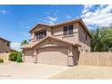 Two-story house with a three-car garage and desert landscaping at 18877 N 59Th Dr, Glendale, AZ 85308