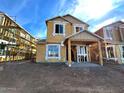 Two-story house under construction, featuring a covered porch and modern design at 26111 N 23Rd Ave, Phoenix, AZ 85085