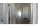 View of the entryway revealing the flooring and long hallway, with a door on the right at 2657 E Abe Truckle Ave, San Tan Valley, AZ 85140