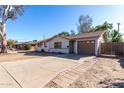 Ranch home with a spacious yard and attached garage at 2905 W Stella Ln, Phoenix, AZ 85017