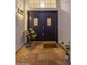 Elegant entryway with double doors and terracotta tile flooring at 3077 W Ironwood Cir, Chandler, AZ 85226