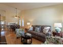 Open living room and dining area with hardwood floors at 3344 E Crescent Ave, Mesa, AZ 85204