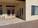 Covered back patio with double doors leading inside at 355 E 13Th Ave, Apache Junction, AZ 85119