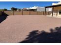 Large gravel backyard with block wall and partial view of home at 355 E 13Th Ave, Apache Junction, AZ 85119