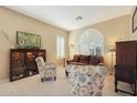 Living room with comfortable seating and large window at 41019 N Congressional Dr, Anthem, AZ 85086