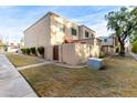 Tan two-story condo building with a courtyard and walkway at 4140 N 81St St, Scottsdale, AZ 85251