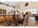 Formal dining room with a large wooden table and chairs at 45583 W Sheridan Rd, Maricopa, AZ 85139