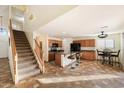 Kitchen with island, wood cabinets and tiled floor at 45583 W Sheridan Rd, Maricopa, AZ 85139