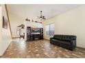 Living room features a fireplace and a large TV at 45583 W Sheridan Rd, Maricopa, AZ 85139