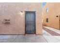 Back door entrance with security door and exterior lighting at 6302 N 64Th Dr # 4, Glendale, AZ 85301