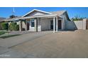 Single story home with a large gravel driveway and landscaped front yard at 6334 W Vogel Ave, Glendale, AZ 85302