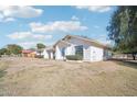 View of the home's side showcasing yard and landscaping at 6611 N 181St Ave, Waddell, AZ 85355