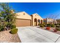 Tan house with brown garage door and nicely landscaped yard at 8088 W Cinder Brook Way, Florence, AZ 85132