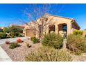 Front view of a single-story house with a desert landscape at 8088 W Cinder Brook Way, Florence, AZ 85132