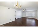 Living room with hardwood floors and lots of natural light at 9838 W Santa Fe Dr, Sun City, AZ 85351