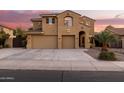 Two-story house with tan exterior, two-car garage, and landscaping at 11249 E Stradling Ave, Mesa, AZ 85212