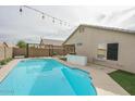 Refreshing blue pool with a large patio area at 13558 W Saguaro Ln, Surprise, AZ 85374