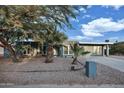 Ranch-style home with desert landscaping and a spacious front yard at 13801 N 57Th St, Scottsdale, AZ 85254