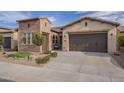 Charming home showcasing an attached garage and neat landscaping at 1416 E Artemis Trl, Queen Creek, AZ 85140