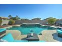 Large, refreshing pool with ample surrounding patio space at 14877 N 145Th Dr, Surprise, AZ 85379